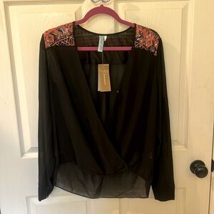 Brand new boutique blouse with sequin detail